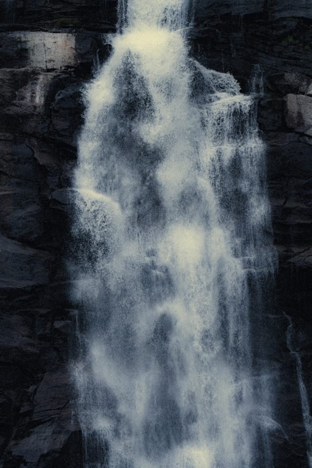 Moving water descending through rock and atmospheric light, catalog number 20, from the Falling Water collection