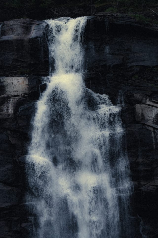 Moving water descending through rock and atmospheric light, catalog number 11, from the Falling Water collection