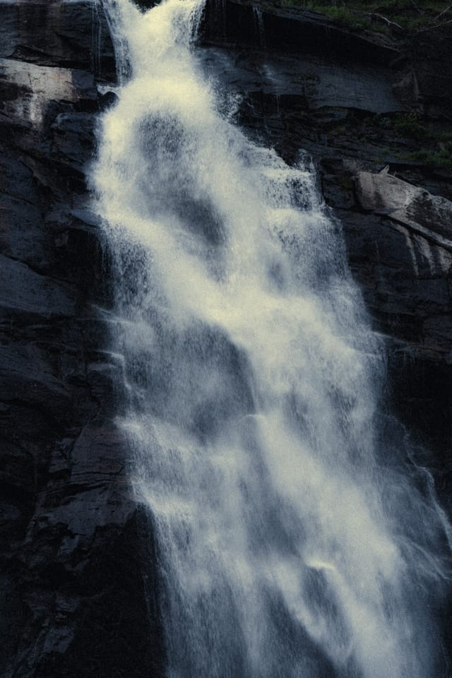 Moving water descending through rock and atmospheric light, catalog number 8, from the Falling Water collection