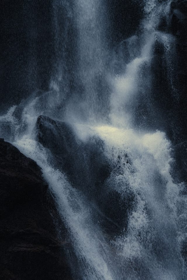 Moving water descending through rock and atmospheric light, catalog number 16, from the Falling Water collection
