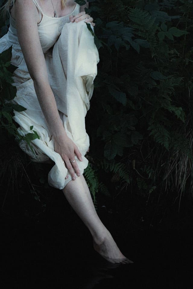 A resting body held among ferns and the forest floor, catalog number 12, from the Fernbed Body series