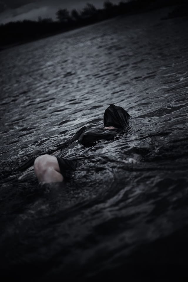 A human figure held in landscape, water or shadow, catalog number 92, from the Silent Figures collection
