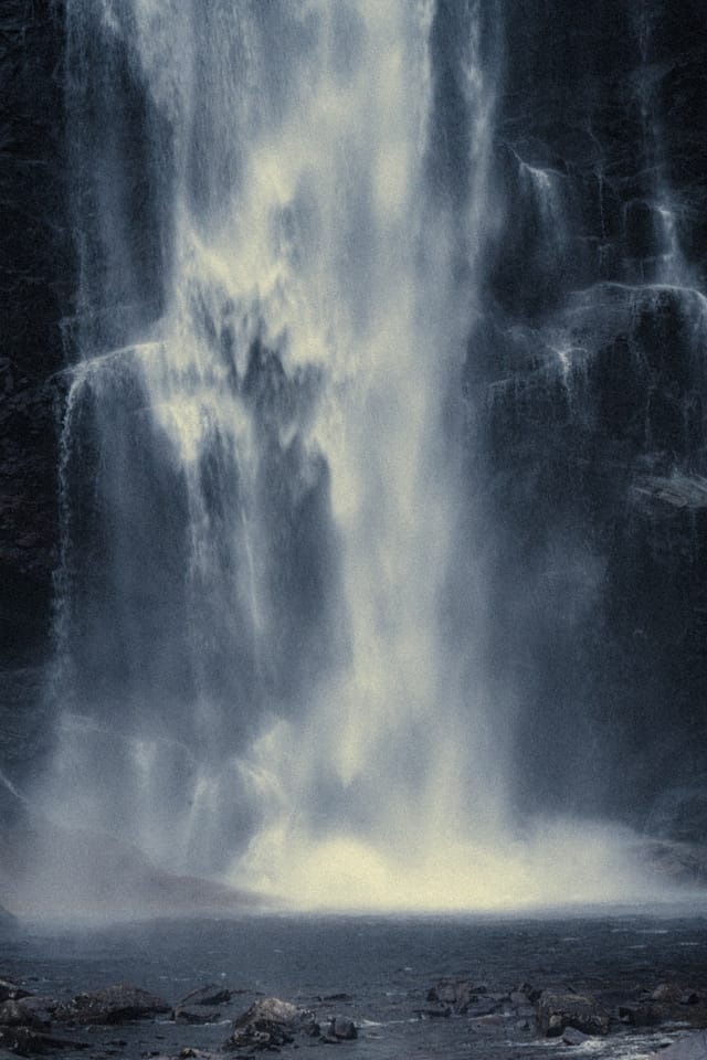 Moving water descending through rock and atmospheric light, catalog number 17, from the Falling Water collection