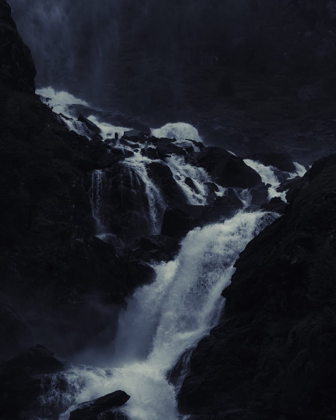 Moving water descending through rock and atmospheric light, catalog number 7, from the Falling Water collection
