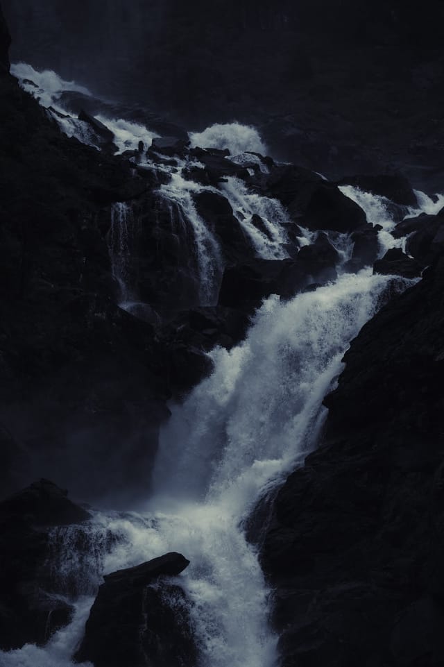 Moving water descending through rock and atmospheric light, catalog number 5, from the Falling Water collection